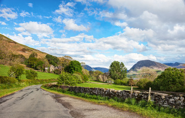 Road  through the countryside,  Lake District National Park, Cumbria, England, UK.