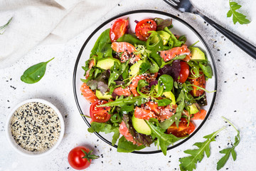 Salmon salad on white top view.