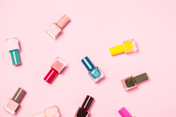 Nail polish bottles pattern background. Close up.