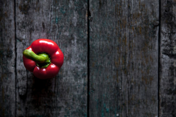 Red bell pepper background on the wooden background - Powered by Adobe