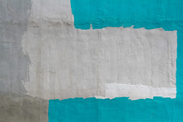 Colorful (gray, turquoise and white) concrete wall as background, texture