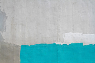 Colorful (gray, turquoise and white) concrete wall as background, texture