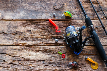 Kurgan, Russia-June 19, 2019 fishing tackle on a wooden background with space for text. spinning hooks silicone bait
