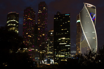 Night view of the modern architectural complex of Moscow city with multicolored illumination Russia