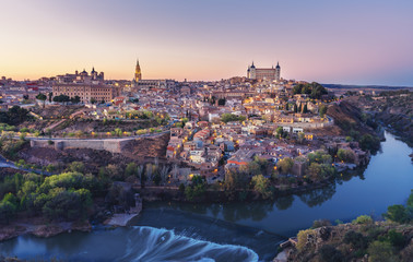 Beautiful view of Toledo city skyline with Cathedral, Alcazar and Tagus River at sunset - Toledo, Castila La Macha, Spain - obrazy, fototapety, plakaty