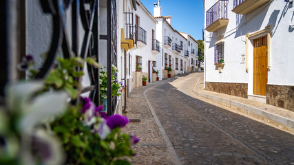 Street of Zahara the la Sierra with its white houses - Zahara de la Sierra, Cadiz Province, Andalusia, Spain