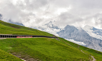 Swiss Mountain Side Train Tunnel with the Apls in the Background - Beautiful and Picuturesque 