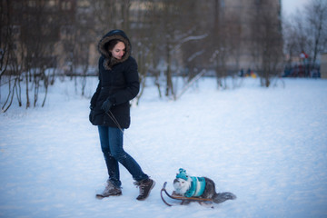 girl sledding a cat