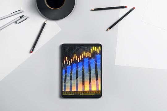 Digital tablet closeup top view with financial graph on screen. Online trading application concept. 3d rendering. - Powered by Adobe