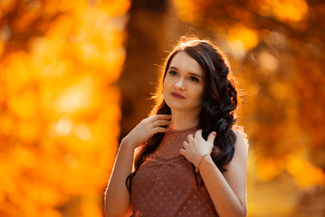 pregnant girl in dress walks through the woods