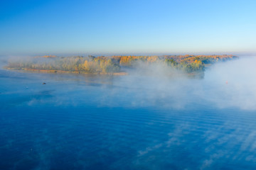 Fog over the water on a river Dnieper on autumn