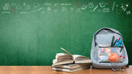 Back to school concept with school books, textbooks, backpack and stationery supplies on classroom...