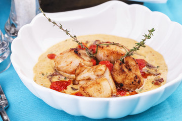 Mediterranean soup with seafood, crab meat, fish and chicken with creamy broth
