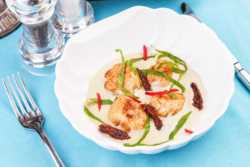 Mediterranean soup with seafood, crab meat, fish and chicken with creamy broth