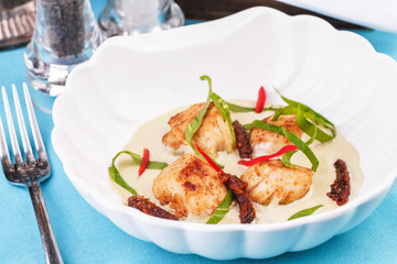 Mediterranean soup with seafood, crab meat, fish and chicken with creamy broth