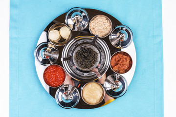  Appetizer of black and red caviar with assorted sauces according to the Mediterranean recipe