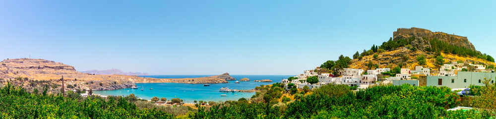 Fototapeta na wymiar Lindos with its beautiful bay and the Acropolis
