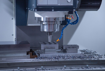 High precision CNC milling machine cutting workpiece, Industrial metalworking machinery