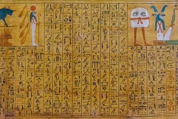 Egyptian ancient papyrus with the different pictures and hieroglyphics