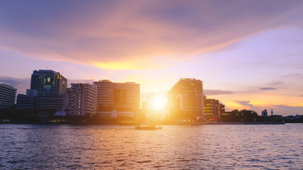 Sunset view of Downtown at Chao Phraya River, bangkok thailand.