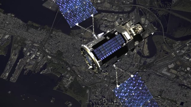 Satellite flying in outer space over a city. Modern spacecraft with solar panels is orbiting the Earth on city background. NASA images animation of a satellite in 4k. New space technologies concept.