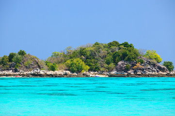 Fototapeta na wymiar View of a tropical coast with a turquoise clear sea at Koh Lipe Thailand