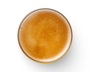 top view of beer bubbles in glass cup on white background.