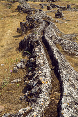 ancient stone aqueduct in the wood in summer the weather
