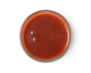 A glass of tomato juice isolated on white background, top view, with clipping path.