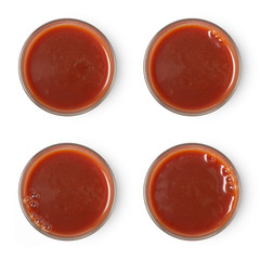 glass of tomato juice assortment isolated on white background, top view.
