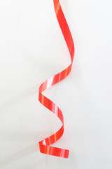 Red ribbon on white background