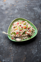 Dapde Pohe is a typical Maharashtrian breakfast, made with thin variety of poha and fresh coconut with chilli, peanuts and nuts. served in a bowl or plate. selective focus