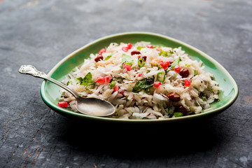 Dapde Pohe is a typical Maharashtrian breakfast, made with thin variety of poha and fresh coconut with chilli, peanuts and nuts. served in a bowl or plate. selective focus