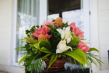 Beautiful tropic flowers decor at hotel table