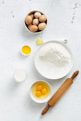 Obraz na płótnie Canvas Dough ingredients on a white background top view