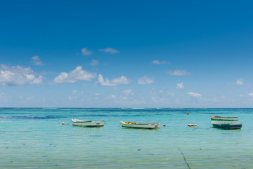 Naklejka na ściany i meble Many small boats near indian ocean coastline