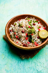 Dapde Pohe is a typical Maharashtrian breakfast, made with thin variety of poha and fresh coconut with chilli, peanuts and nuts. served in a bowl or plate. selective focus