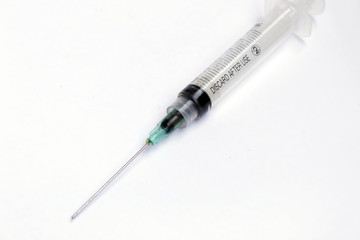 photo of used syringes on isolated background