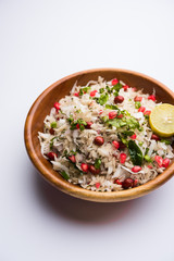 Dapde Pohe is a typical Maharashtrian breakfast, made with thin variety of poha and fresh coconut with chilli, peanuts and nuts. served in a bowl or plate. selective focus