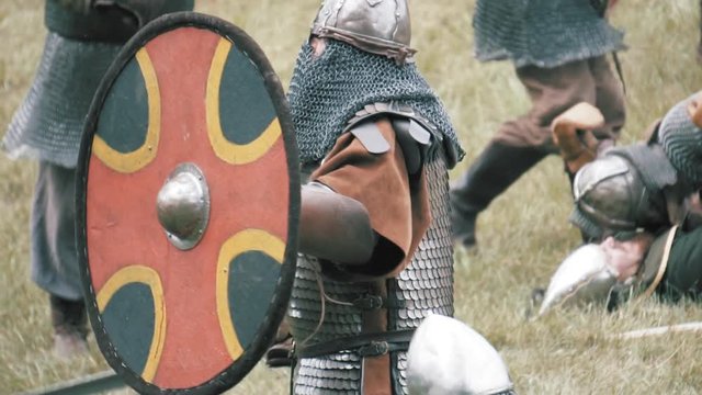 Knight warriors in battle. Medieval soldiers in full armor in melee combat