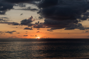 Naklejka na ściany i meble Dramatic sky sunset at indian ocean landscape