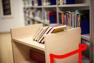 Blurred background. Library, books. Close-up.