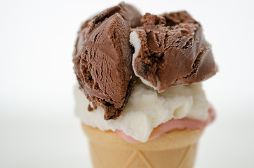 Chocolate ice cream ball and chocolate sauce isolated on white background