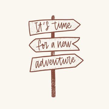 It's Time For A New Adventure inspirational phrase handwritten with elegant cursive font on signpost or guidepost