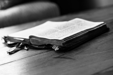 Holy Bible isolated on old vintage wooden table