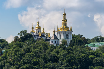 Fototapeta na wymiar View of the Kyiv-Pechersk Lavra on a sunny summer day, Kiev, Ukraine. Historical and cultural reserve – UNESCO object in Ukraine