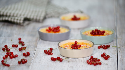 Creme brulee or cream brulee, burnt cream with red currant.
