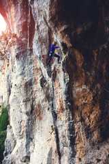 Fototapeta premium A rock climber on a rock.