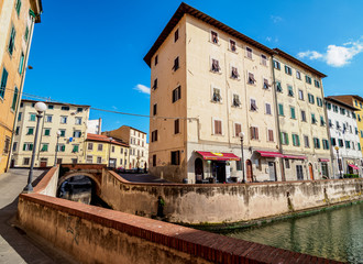 Fototapeta na wymiar Canal in Venezia Nuova, Livorno, Tuscany, Italy