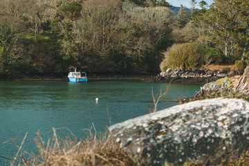 Fototapeta premium motor boat at lake shore